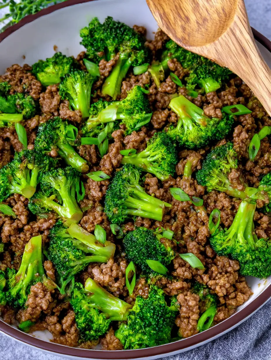 A skillet of ground beef and broccoli.