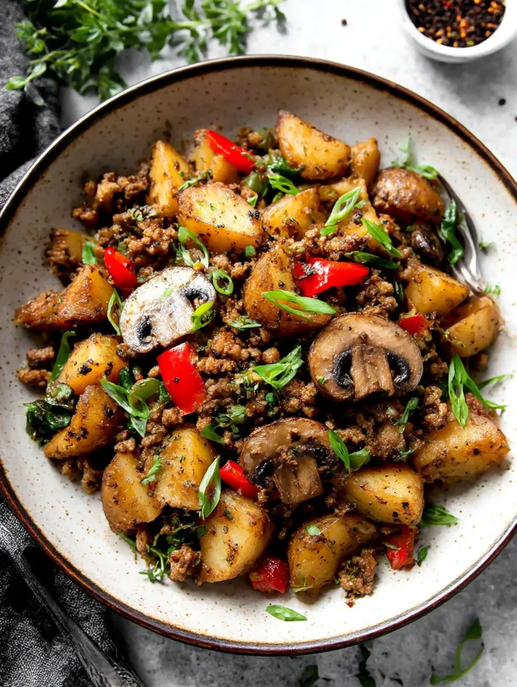A bowl of Mediterranean ground beef stir fry.