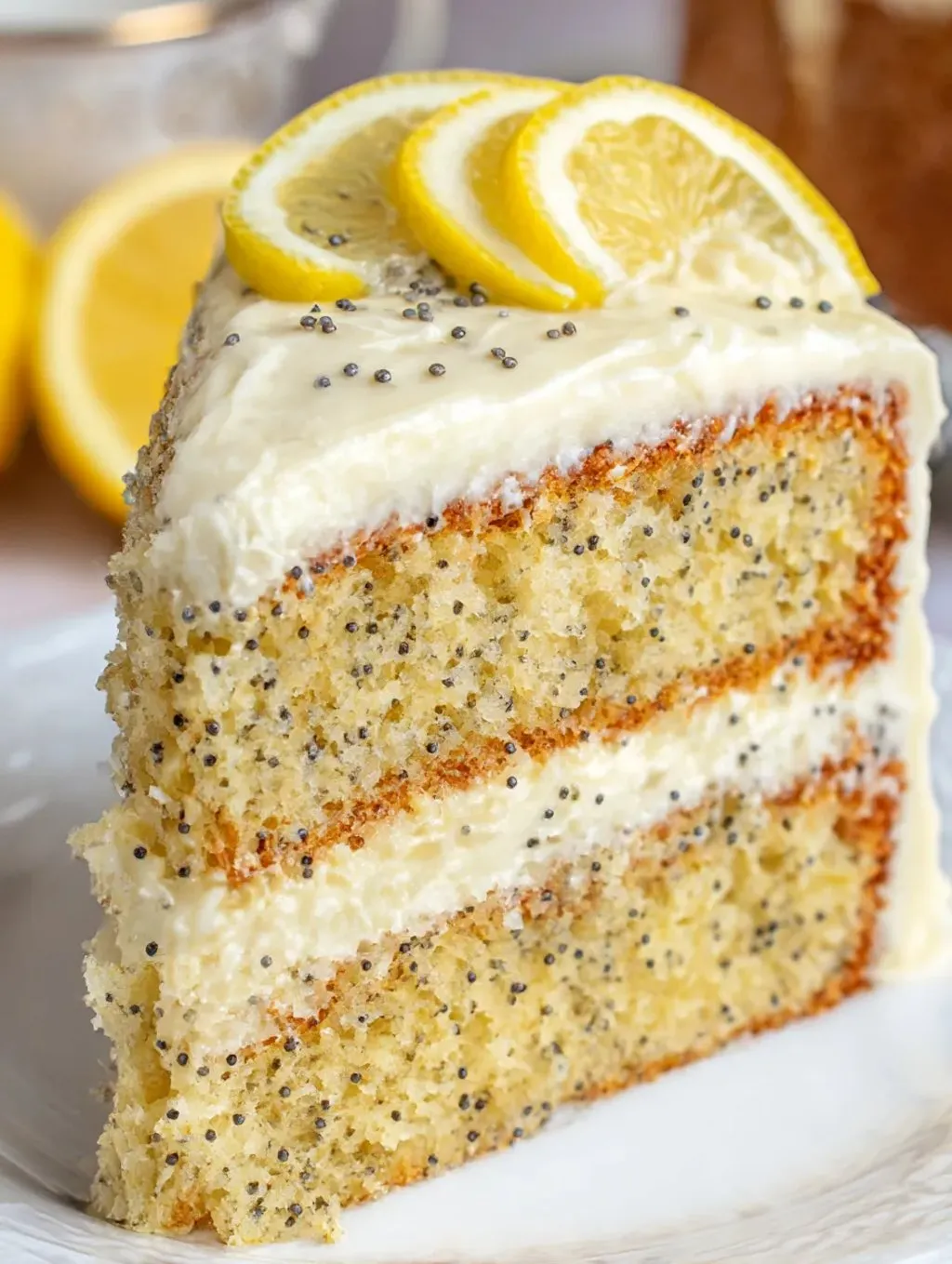 A slice of cake with lemon on top.