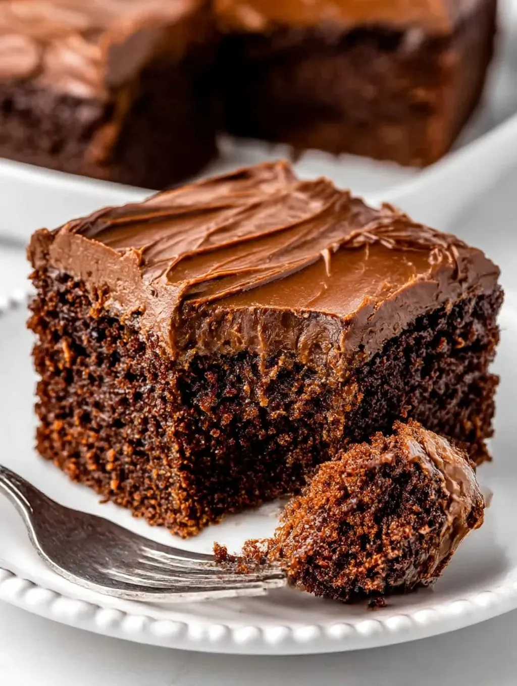 A piece of chocolate cake on a plate.