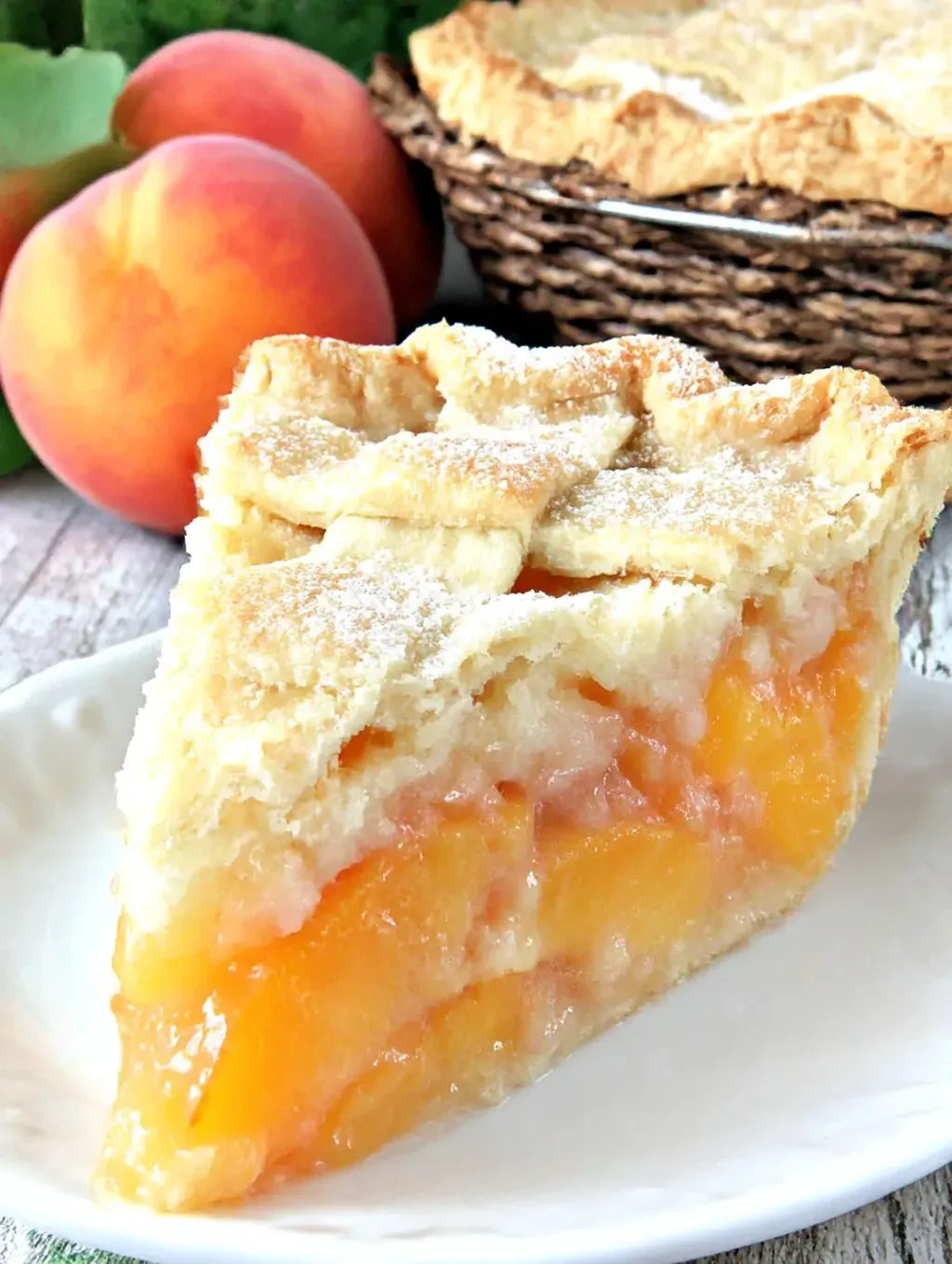 A slice of peach pie on a plate.