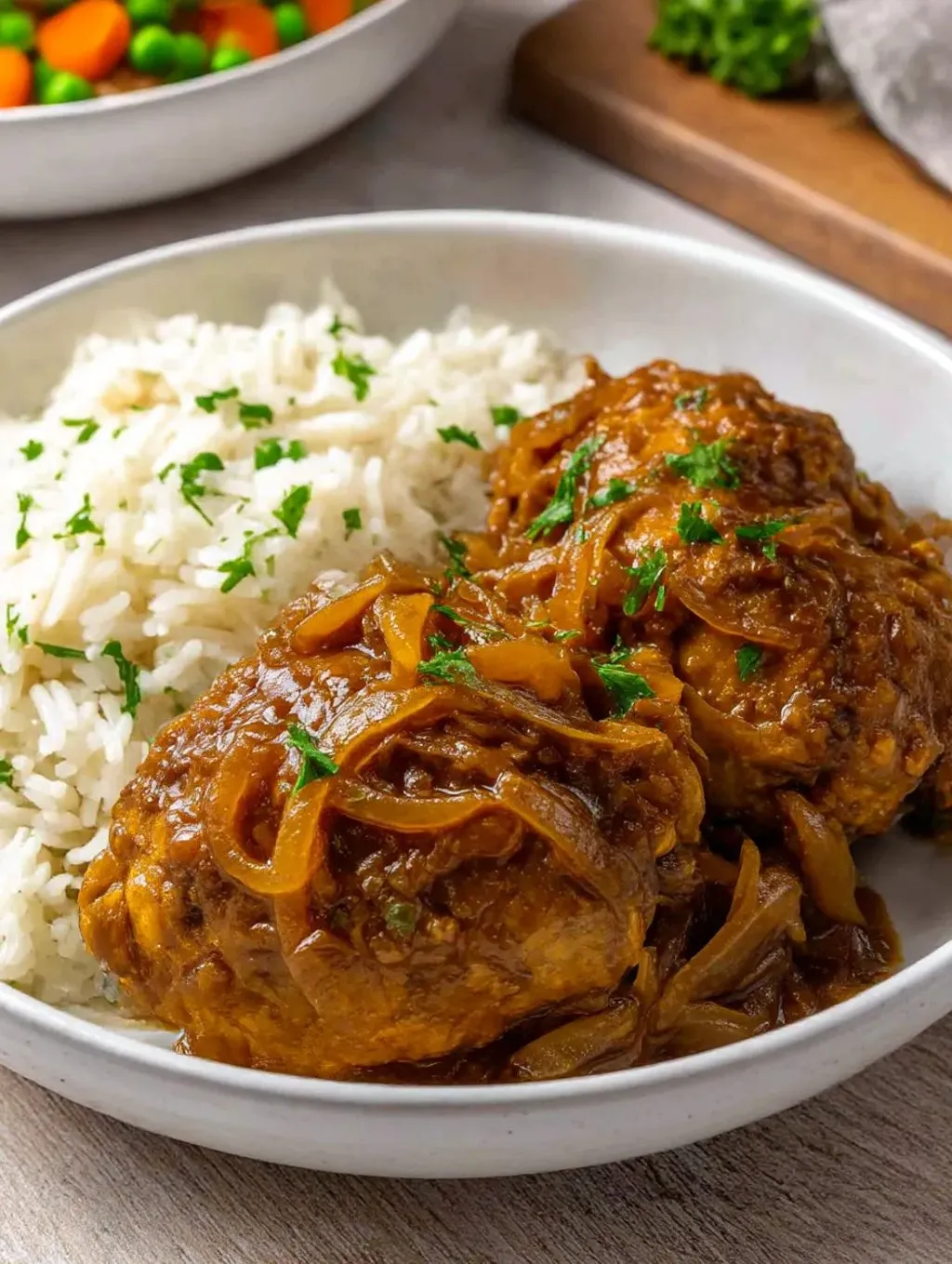 A plate of food with rice and chicken.