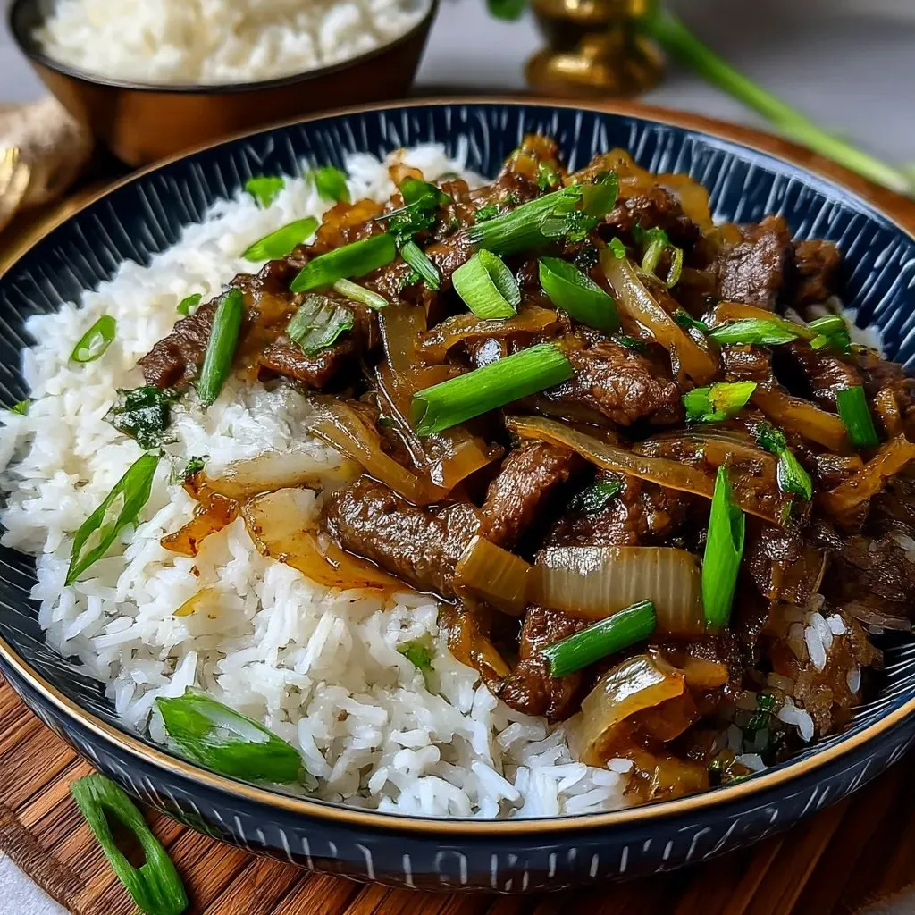 A plate of Chinese beef and onion stir fry.