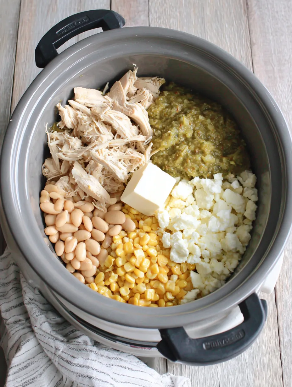 A pot of food with beans, corn, and chicken.