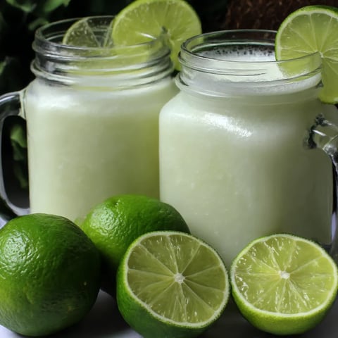Two jars of Brazilian lemonade with coconut.