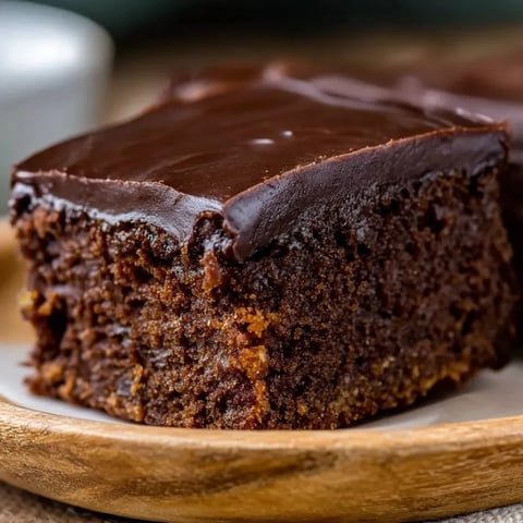A slice of chocolate cake with a sweet potato topping.